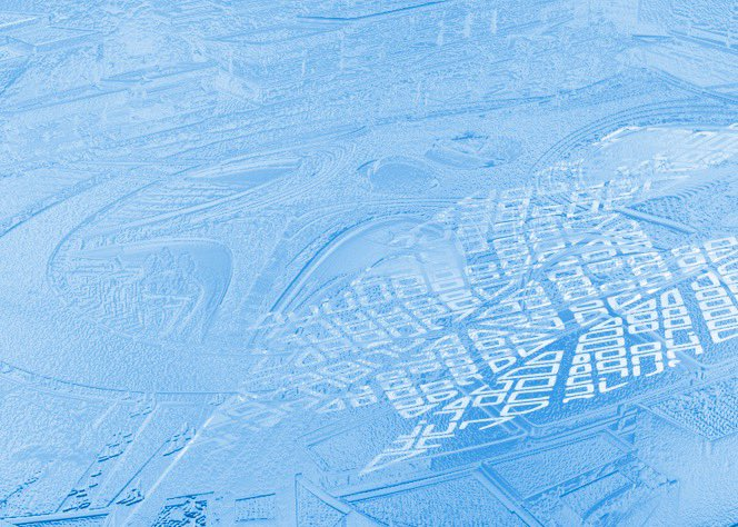 Blue architectural model of a city, showing buildings, streets, and surrounding terrain.